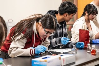 students review lab specimens